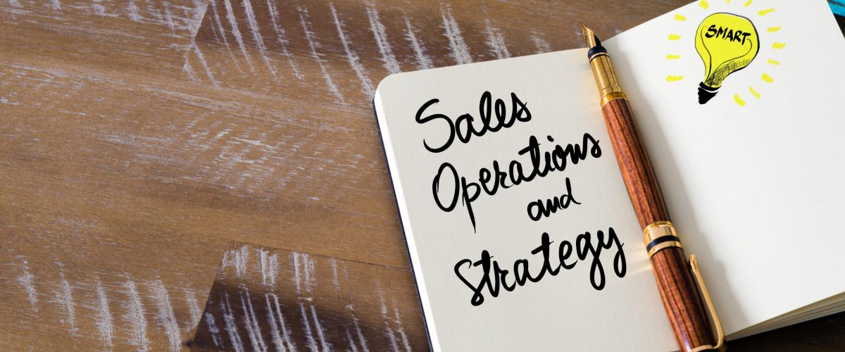 Notebook with Sales Operations and Strategy written in it.